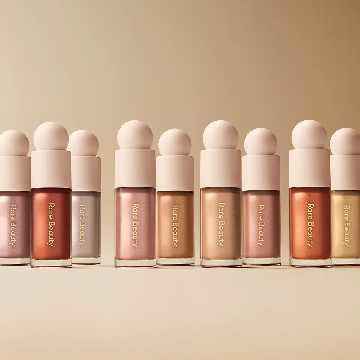 Rare Beauty – Iluminador Mini Líquido Positive Light Luminizer